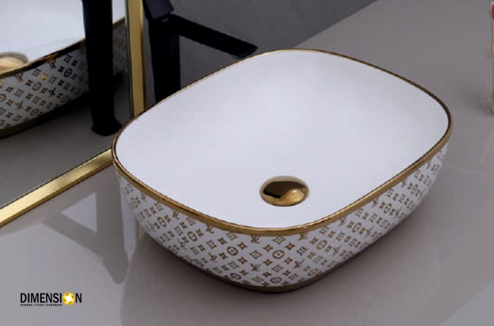 curved golden and white designer wash basin