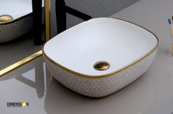 curved golden and white designer wash basin