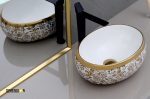 golden and white designer wash basin